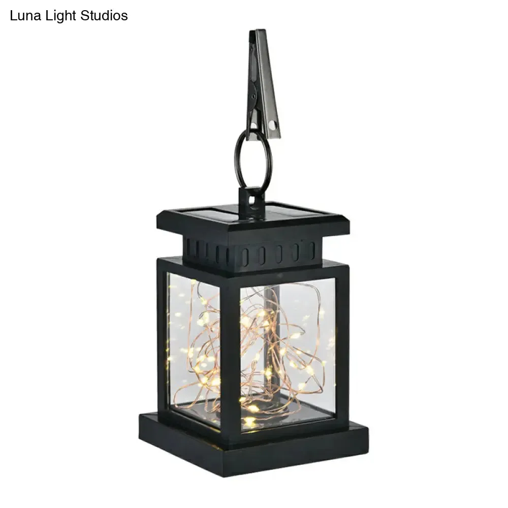 Artistic Black LED Solar Lantern Pendant Light with Clear Glass, Clamp, and Hook