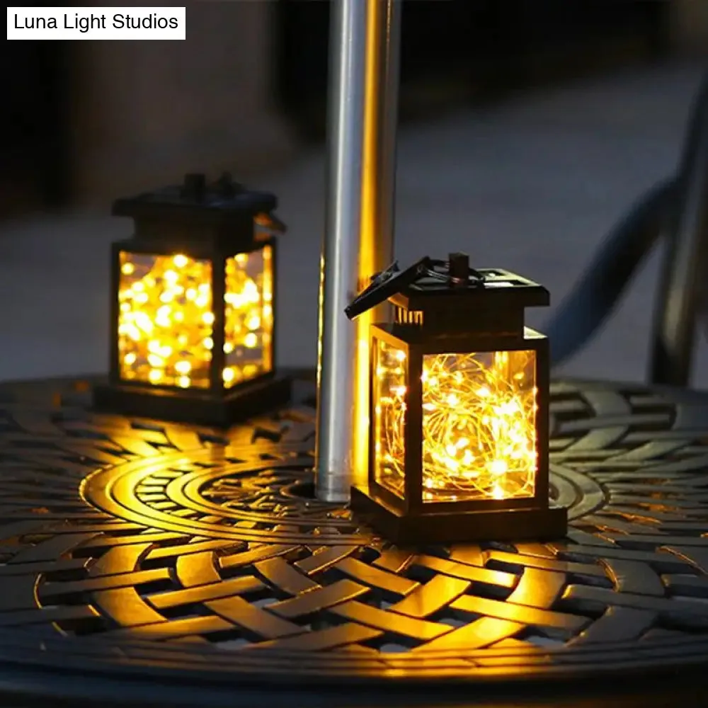 Artistic Black LED Solar Lantern Pendant Light with Clear Glass, Clamp, and Hook